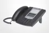 A black desk phone with a handset and a coiled cord, placed on a light gray background. The phone is angled, showing its keypad, screen, and a built-in stand. Produktbild-Vorschau