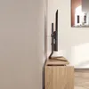 A TV stand with a TV mounted on it, placed on a wooden cabinet in a room. Náhled obrázku produktu
