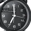 Close-up of an analog alarm clock face with hands pointing to approximately 7:05. Produktbild-Vorschau