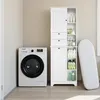 A white storage cabinet and a white washing machine are shown in a laundry room setting. Náhled obrázku produktu