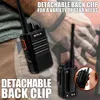 A close-up shot of a black walkie-talkie attached to a person's pants, with text overlays highlighting its features. Produktbild-Vorschau