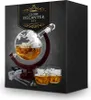 A product box for a globe decanter set, showing the decanter filled with amber liquid, two glasses with ice and liquid, and whiskey stones. Náhľad obrázku produktu