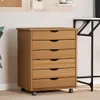 A wooden cabinet with six drawers and wheels is shown in an indoor setting. Voir les images du produit