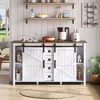 A white sideboard with sliding barn doors and drawers, styled in a kitchen or dining area with shelves above and a round rug on the floor. Voir les images du produit