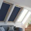 A living room with skylights covered by dark blue blackout blinds, a sofa, and a wooden dresser. Produktbild-Vorschau