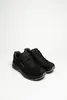 A pair of black hiking shoes on a white background. Voir les images du produit