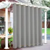 Outdoor patio area with a table and chairs, partially covered by a pergola with curtains. Produktbild-Vorschau