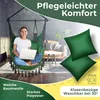 A woman is sitting in a green hanging chair indoors, using a laptop. There are decorative pillows and text overlays highlighting product features. Produktbild-Vorschau