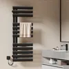 A modern black electric towel warmer in a bathroom setting, with a towel draped over it. Anteprima dell’immagine prodotto