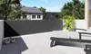 A balcony with a privacy screen and lounge chairs. Produktbild-Vorschau