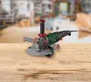 An angle grinder is placed on a wooden surface with a blurred workshop background. Produktbild-Vorschau