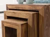 A close-up view of three nested wooden tables made of dark brown wood. Voir les images du produit
