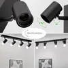 A collage of images showing a black ceiling light fixture with adjustable spotlights. Voir les images du produit