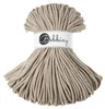 A spool of beige macrame cord with a branded label. Podgląd zdjęcia produktu