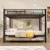 A black metal bunk bed with a pull-out trundle bed, set up in a child's room with decorative wall art and bedding. Produktbild-Vorschau