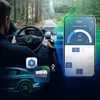 A person driving a car, with a smartphone mounted on the dashboard displaying a PEME app interface. Icons representing Bluetooth and a portable cooler are also visible. Náhled obrázku produktu