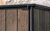 Close-up of the corner of a wooden-look storage cabinet. Produktbild-Vorschau