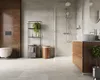 A modern bathroom with a toilet, shower, and vanity. Produktbild-Vorschau