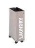 A tall, narrow laundry hamper with wheels and the word "LAUNDRY" printed vertically on its side. Anteprima dell’immagine prodotto