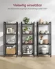 Three black shelving units are displayed against a white wall, showcasing various items on their shelves. The units are filled with decorative items, plants, kitchenware, and books, suggesting versatility in use. Produktbild-Vorschau