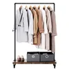 A clothing rack with several coats and two storage bins on a shelf. Náhled obrázku produktu