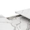 A close-up view of a marble-patterned table with extension slides. Anteprima dell’immagine prodotto