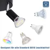 A collage of a black ceiling spotlight and various LED light bulbs, some showing different colors. Produktbild-Vorschau