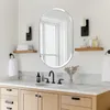 A modern bathroom vanity with a mirror, sink, faucet, and accessories. Podgląd zdjęcia produktu
