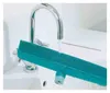 A teal rubber broom is being rinsed under a running faucet in a white sink. Produktbild-Vorschau