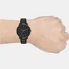 A man's wrist wearing a black Armani Exchange watch. Anteprima dell’immagine prodotto