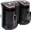 A black dual-compartment Turkish coffee maker with rose gold accents, shown from a slightly elevated front-side angle on a white background. Produktbild-Vorschau