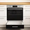 A modern kitchen with a built-in oven and drawers. Náhľad obrázku produktu