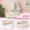 A child's pink vanity table with accessories, shown in a room setting with decorative elements. Produktbild-Vorschau