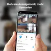 A person is holding a smartphone displaying a security camera app with multiple camera feeds and display mode options. Produktbild-Vorschau