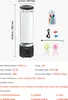 A product shot of a jellyfish lava lamp with its accessories and a remote control, along with a diagram showing its dimensions and specifications. Voir les images du produit