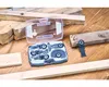 A set of Bosch Starlock wood saw blades is laid out on a wooden surface with pieces of wood. Voir les images du produit