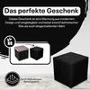Marketing image showing a black cube ottoman and a diagram illustrating its transformation. Produktbild-Vorschau
