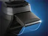 A close-up shot of an electric shaver head with a blue glow highlighting the blades. Náhled obrázku produktu