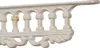 A close-up of a white cast iron shelf bracket with ornate detailing. Náhľad obrázku produktu