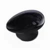 A black, egg-shaped projector on a black base, isolated on a white background. Produktbild-Vorschau
