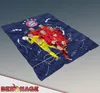 A folded FC Bayern München blanket with player illustrations and tactical drawings. Produktbild-Vorschau
