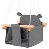 A close-up studio shot of a gray baby swing with wooden bars.