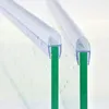 Close-up of two clear plastic shower door seals attached to green glass panels. Podgląd zdjęcia produktu