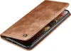 A brown leather flip case for a smartphone, shown from a diagonal angle with the cover open. Produktbild-Vorschau