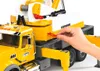 A hand is shown inserting a red plastic piece into a yellow and white toy crane truck. Náhľad obrázku produktu
