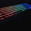 A close-up shot of a laptop keyboard with RGB backlighting. Produktbild-Vorschau