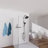 A modern bathroom with a shower, bathtub, and wooden floor. Produktbild-Vorschau