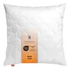 A white quilted pillow with a label attached. Produktbild-Vorschau