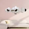 Hexagonal mirror wall stickers arranged on a pink textured wall above a white sofa. Produktbild-Vorschau