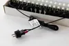 A close-up view of the plug and cord of an LED light string, with the lights themselves visible in the background. Produktbild-Vorschau